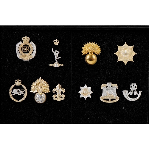 1490 - A collection of military interest cap badges including Royal Hussars, Waterloo Royal Scots Dragoon G... 