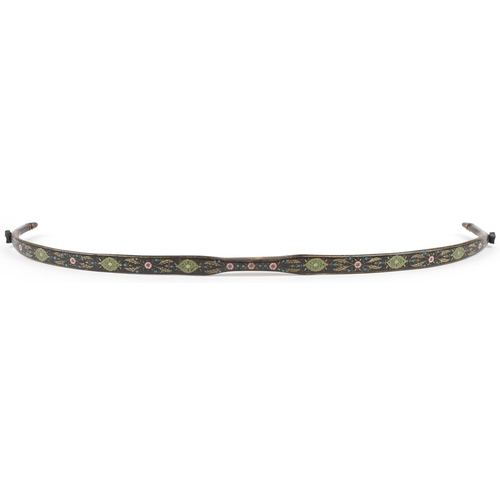 384 - A Turkish Ottoman fighting bow hand painted and gilded with flowers, 88cm in length.