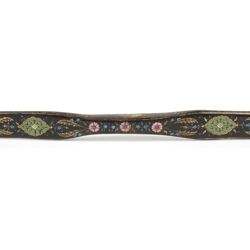 384 - A Turkish Ottoman fighting bow hand painted and gilded with flowers, 88cm in length.