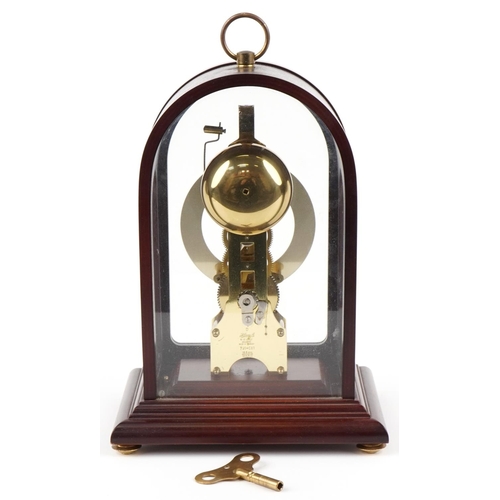 17 - A Hermle mahogany cased dome top mantle clock with visible movement, model 791-081, 32cm high.