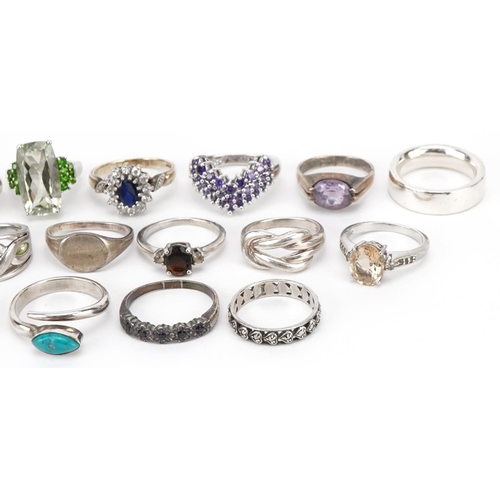 3716 - Twenty silver and white metal rings, some set with semi precious stones, various sizes, total weight... 