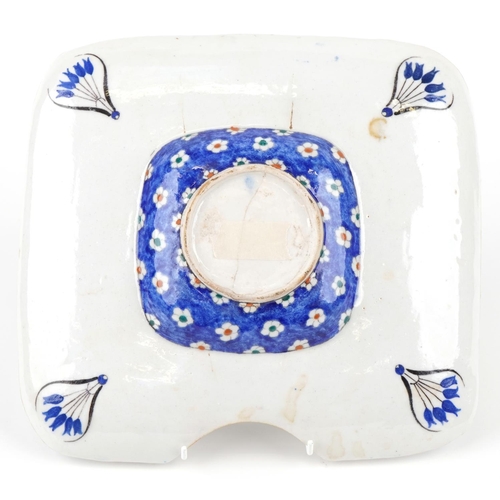 382 - A Turkish Ottoman Iznik barber's bowl, hand painted with flowers, 31cm x 28.5cm