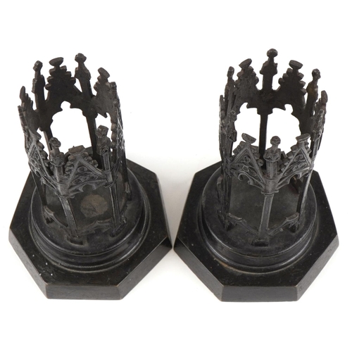 9 - A pair of 19th century bronze ecclesiastical candle holders, each with engraved decoration, raised o... 