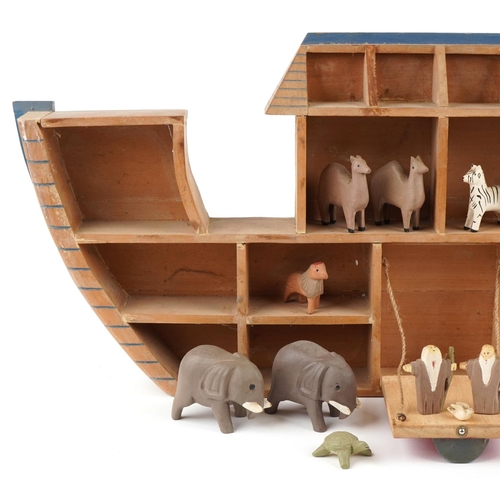 1151 - A 20th century American folk art Noah's Ark diorama with pairs of animals including elephants, giraf... 