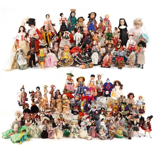 1163 - An extensive collection of souvenir dolls, clowns and animals from around the world, the largest 44c... 