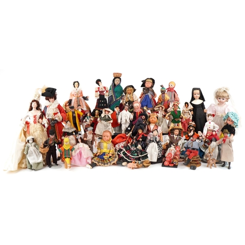 1163 - An extensive collection of souvenir dolls, clowns and animals from around the world, the largest 44c... 