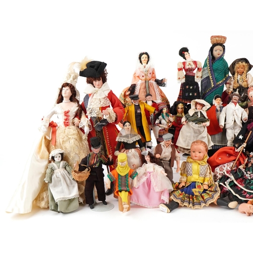 1163 - An extensive collection of souvenir dolls, clowns and animals from around the world, the largest 44c... 