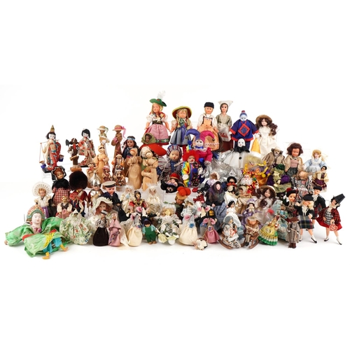 1163 - An extensive collection of souvenir dolls, clowns and animals from around the world, the largest 44c... 