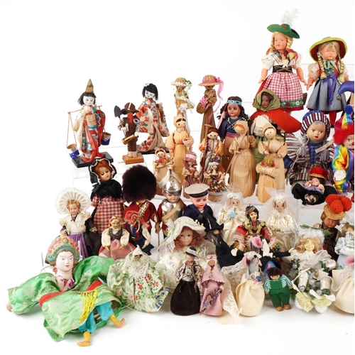 1163 - An extensive collection of souvenir dolls, clowns and animals from around the world, the largest 44c... 