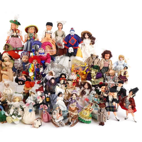 1163 - An extensive collection of souvenir dolls, clowns and animals from around the world, the largest 44c... 