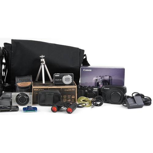 1186 - A collection of cameras and accessories to include a Canon Powershot G10 digital camera, a Canon EOS... 