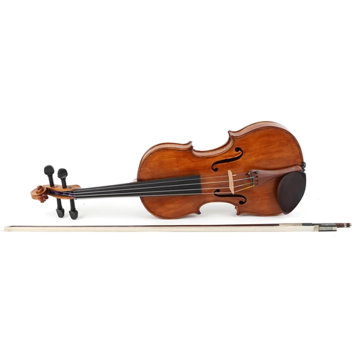 A 19th century French violin with two piece back bearing paper label to the interior, the back 35.5cm in length excluding the button, with a German bow, 74cm in length, together with a hard case.