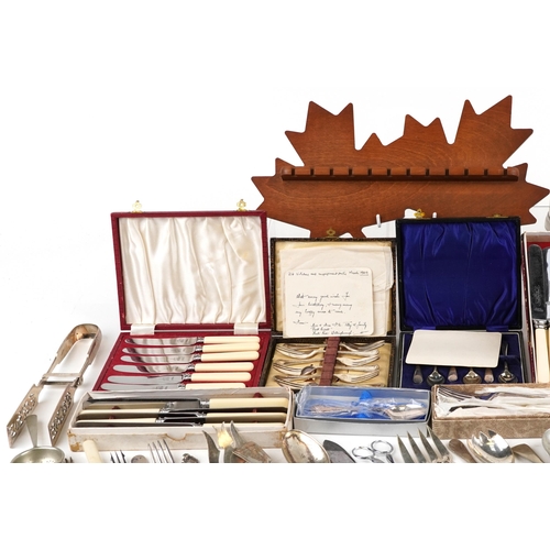 2615 - A large collection of vintage and later silver plated and stainless steel cutlery, some in cases, bo... 