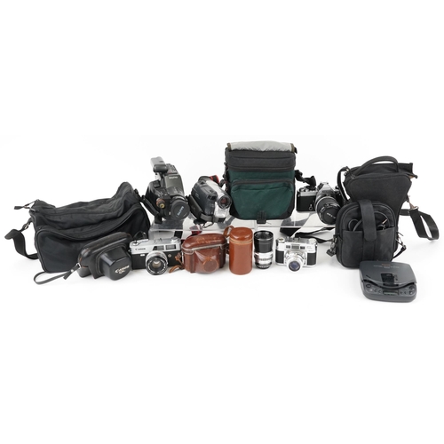 1188 - A group of vintage cameras and accessories including Nikor FM3455140 with 43-86mm lens, Braun Paxett... 