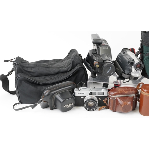 1188 - A group of vintage cameras and accessories including Nikor FM3455140 with 43-86mm lens, Braun Paxett... 