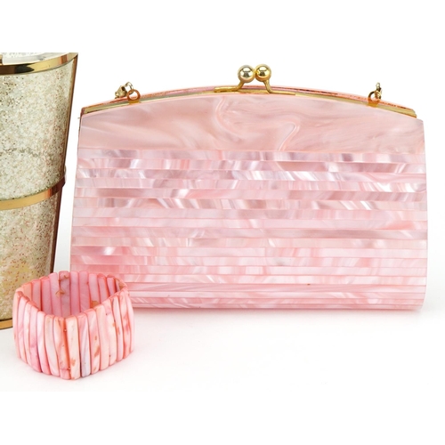 1169 - A vintage faux pink mother-of-pearl clutch bag, 23cm wide, together with a mottled clear Perspex and... 