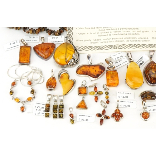 3725 - A large collection of silver mounted amber jewellery, predominantly with Natural Wonders tags, inclu... 