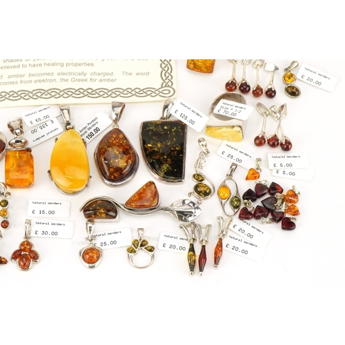 3725 - A large collection of silver mounted amber jewellery, predominantly with Natural Wonders tags, inclu... 