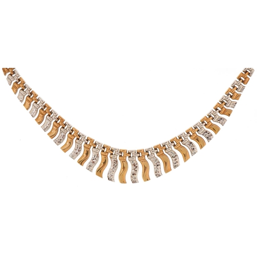 3045 - A Modernist 9ct two tone gold necklace, 43cm in length, 10.8g.