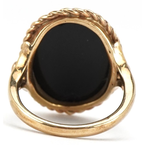 3403 - An antique unmarked gold cameo glass ring decorated with a maiden head, size Q, 8.0g.