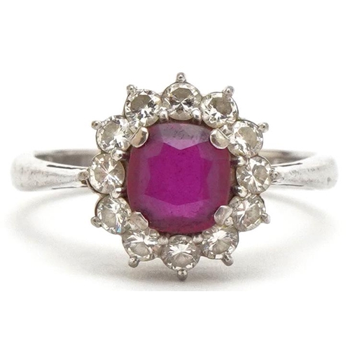 3074 - An 18ct white gold ruby and diamond flower head ring, the ruby approximately 6.15mm in diameter x 2.... 