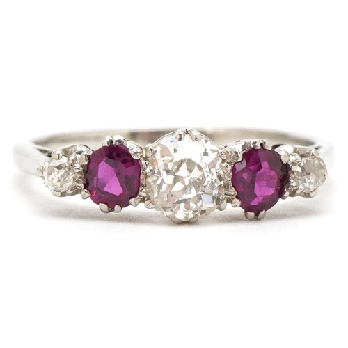 3080 - An unmarked white gold diamond and ruby five stone ring, the central diamond approximately 0.30 cara... 