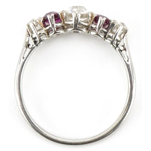 3080 - An unmarked white gold diamond and ruby five stone ring, the central diamond approximately 0.30 cara... 