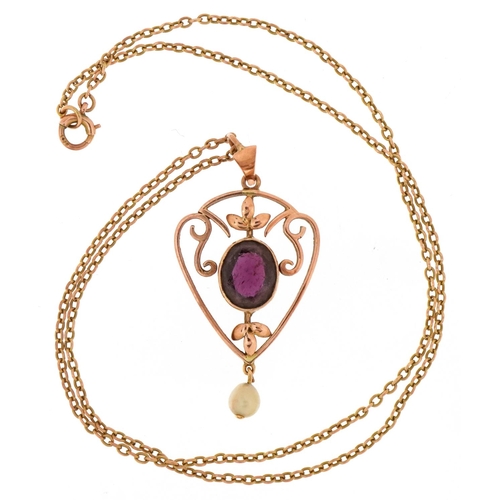 3023 - An Art Nouveau style unmarked gold amethyst and cultured pearl openwork pendant on a yellow metal ne... 