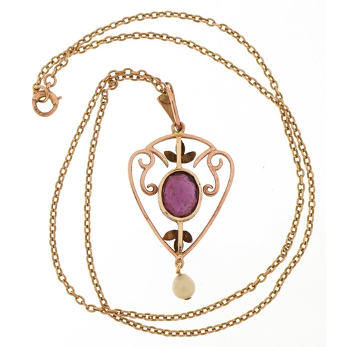 3023 - An Art Nouveau style unmarked gold amethyst and cultured pearl openwork pendant on a yellow metal ne... 