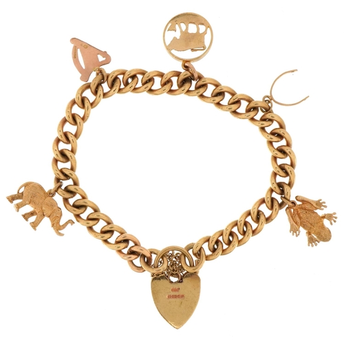 3007 - A heavy 9ct gold charm bracelet with five 9ct gold charms and love heart shaped padlock including el... 