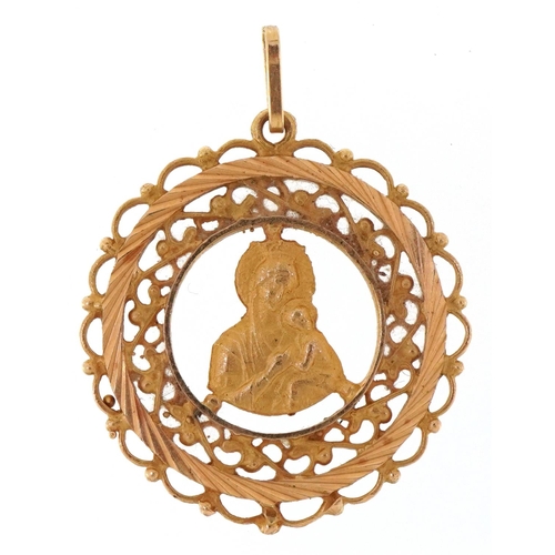 3025 - A 10ct gold pendant decorated with a Madonna and child, 2.5cm in diameter, 3.6g.