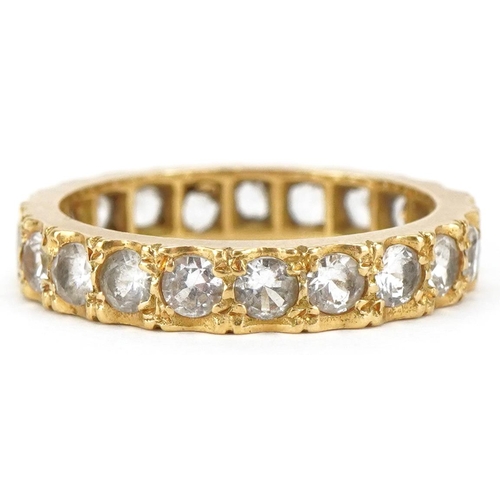 3081 - An unmarked gold white spinel eternity ring, size L, 3.4g.