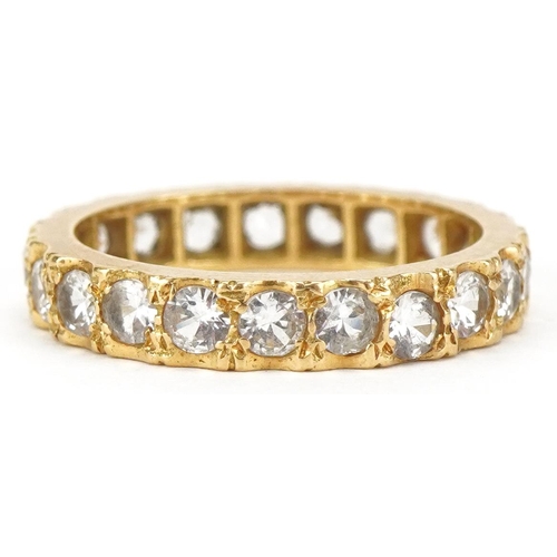 3081 - An unmarked gold white spinel eternity ring, size L, 3.4g.