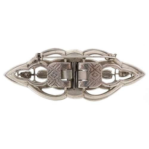 3419 - An Art Deco silver and paste set two piece brooch/hair clip, 7cm wide, 33.4g.