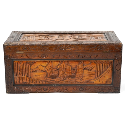 A Chinese carved camphor wood trunk, mid 20th century, profusely carved ...