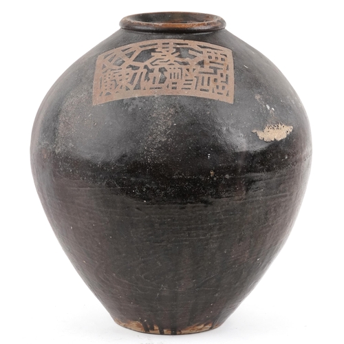 348 - A continental black glazed terracotta olive oil jar, late 20th century, 41cm high.