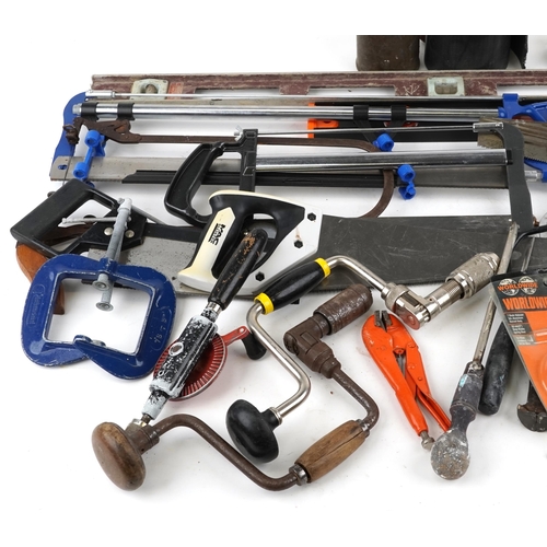 2574 - A group of assorted tools including wood saw, hacksaw, a selection of vintage planes and spirit leve... 