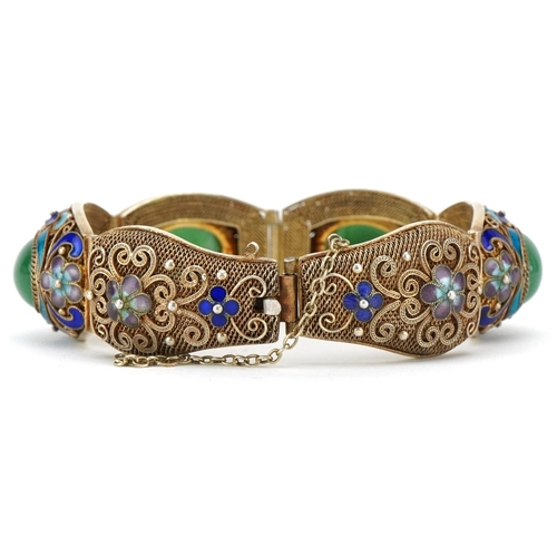 377 - A Chinese export silver gilt filigree and enamelled bracelet, mid 20th century, inset with four poli... 