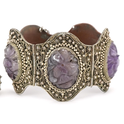 377A - A Chinese export silver filigree and amethyst bracelet, 20th century, inset with five carved stones,... 