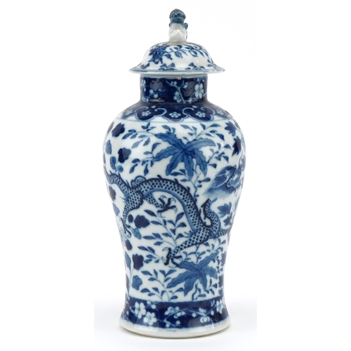 429 - A Chinese blue and white porcelain vase and cover, 19th century, decorated with dragons amongst foli... 