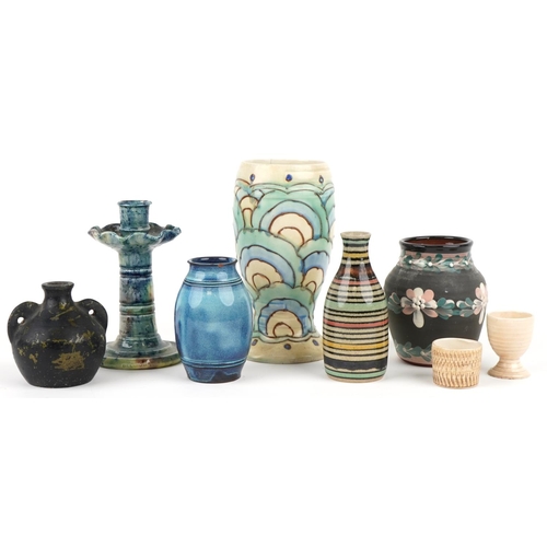 2558 - A small group of mixed pottery items including three vases, two handled jug, candlestick and two egg... 