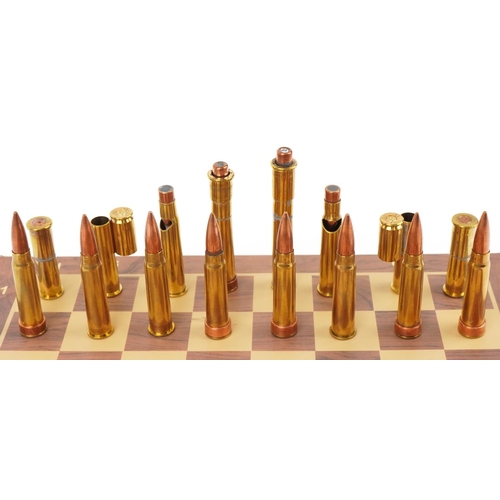 1491 - A military interest copper and brass ammunition shell case chess set with magnetic bases and The Pre... 