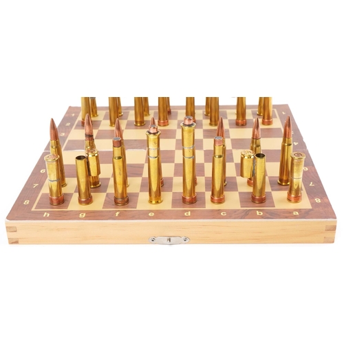 1491 - A military interest copper and brass ammunition shell case chess set with magnetic bases and The Pre... 