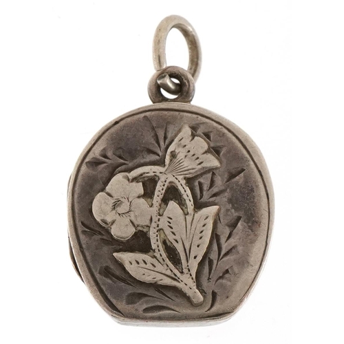 3560 - An Edwardian silver floral engraved locket, Chester 1906, 2cm high, 3.0g.