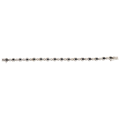 3078 - A silver and sapphire infinity link bracelet, 18cm in length, 12.0g.