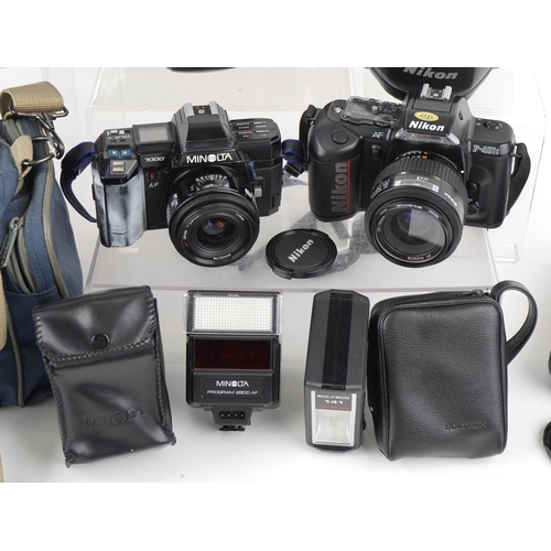 1187 - Two cameras and lenses comprising a Minolta 7000 together with a Minolta AF 70-210 lens and Nikon F-... 