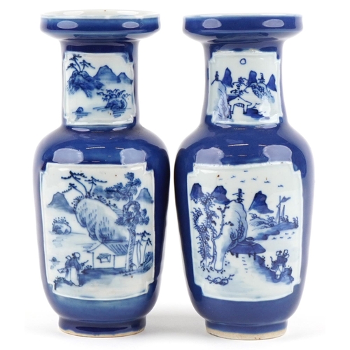 2557 - A pair of Chinese blue and white porcelain vases, 20th century, each with landscape panels, 25cm hig... 