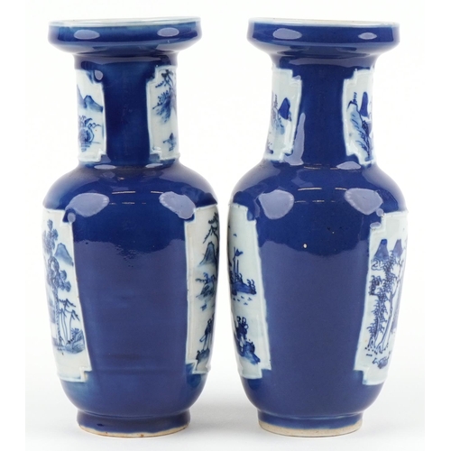 2557 - A pair of Chinese blue and white porcelain vases, 20th century, each with landscape panels, 25cm hig... 