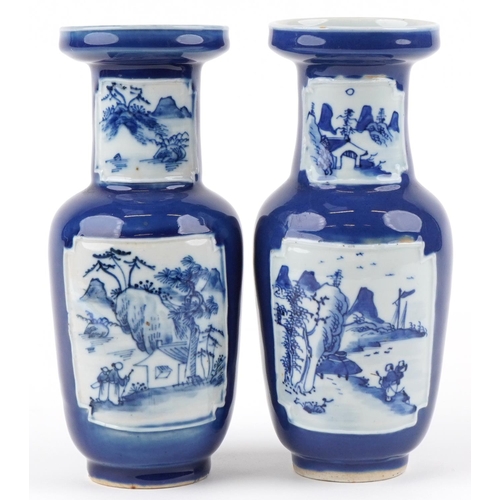 2557 - A pair of Chinese blue and white porcelain vases, 20th century, each with landscape panels, 25cm hig... 