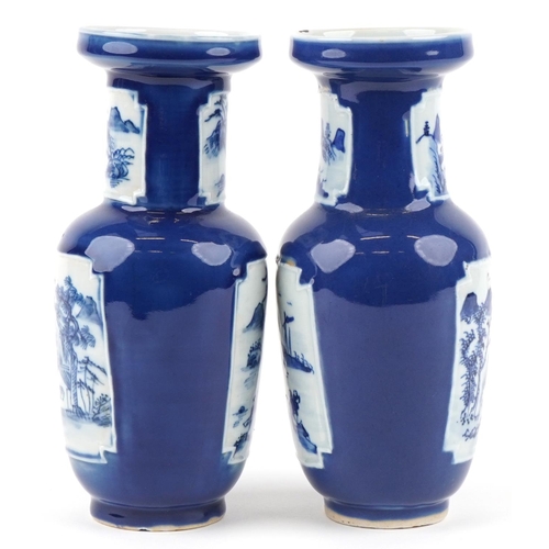 2557 - A pair of Chinese blue and white porcelain vases, 20th century, each with landscape panels, 25cm hig... 